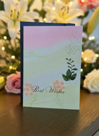 Greeting card with 'Best Wishes' text and decorative elements like flowers Lillies and Roses